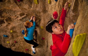 Visitors test their mountaineering ability with a horizontal climb around a rock wall. By measuring height and arm span, then plotting the results of ratio of arm span to height on a scatter plot, they can determine how efficient they are as rock climbers compared to others.